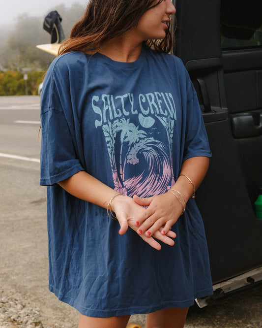 Lifestyle shot of the Big Wave Cover Up Tee - Denim. 