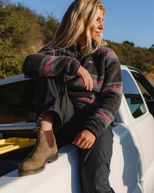 Lifestyle shot of the Calm Seas Pullover - Charcoal. 