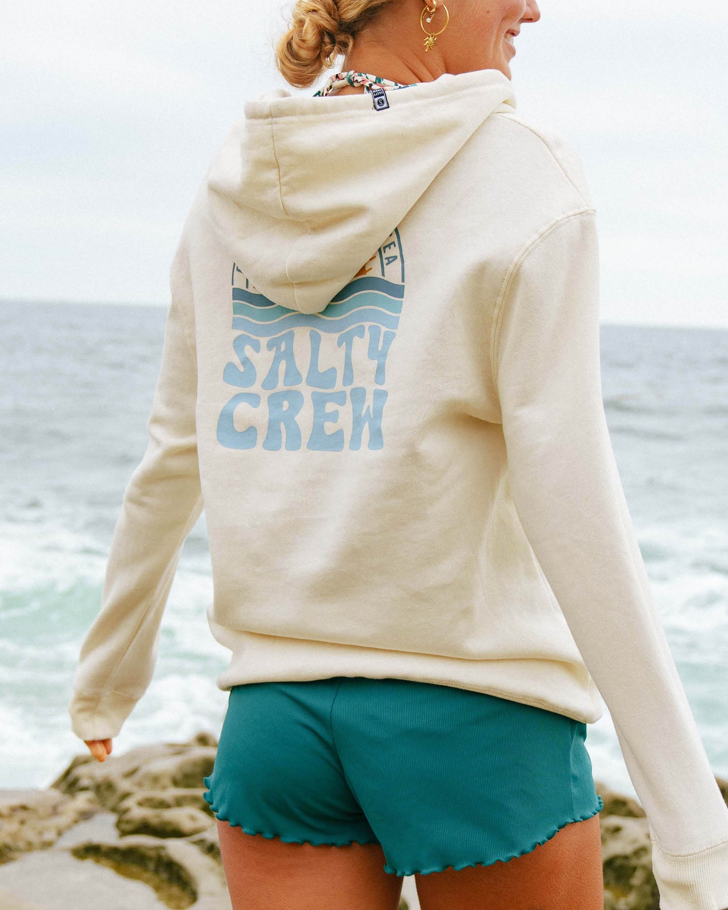 Lifestyle shot of the Sundown Zip Fleece Hoodie - Bone. 