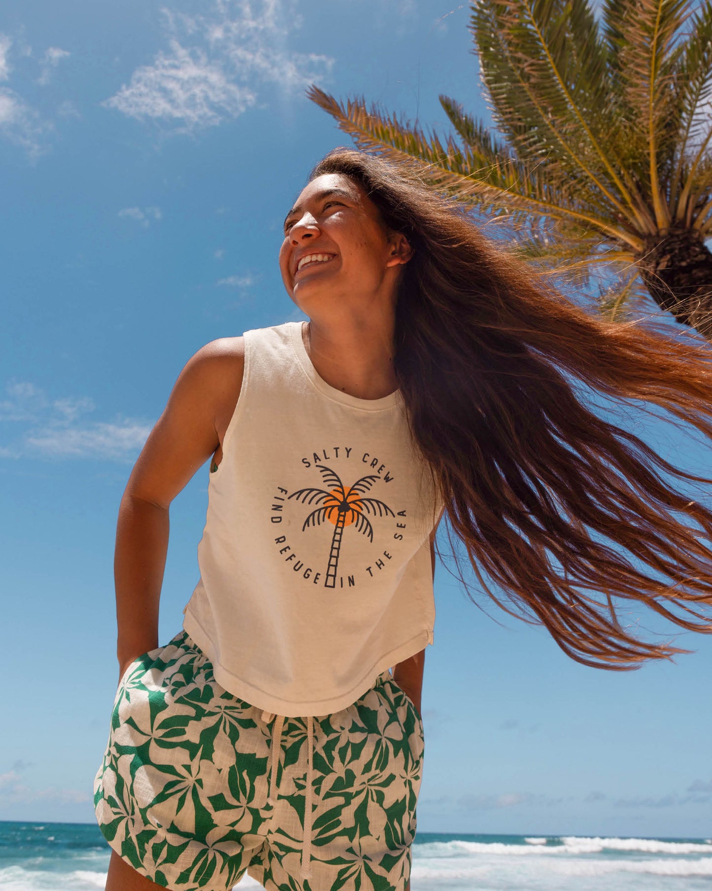 Lifestyle shot of the Queen Palm Cropped Tank - Off White. 