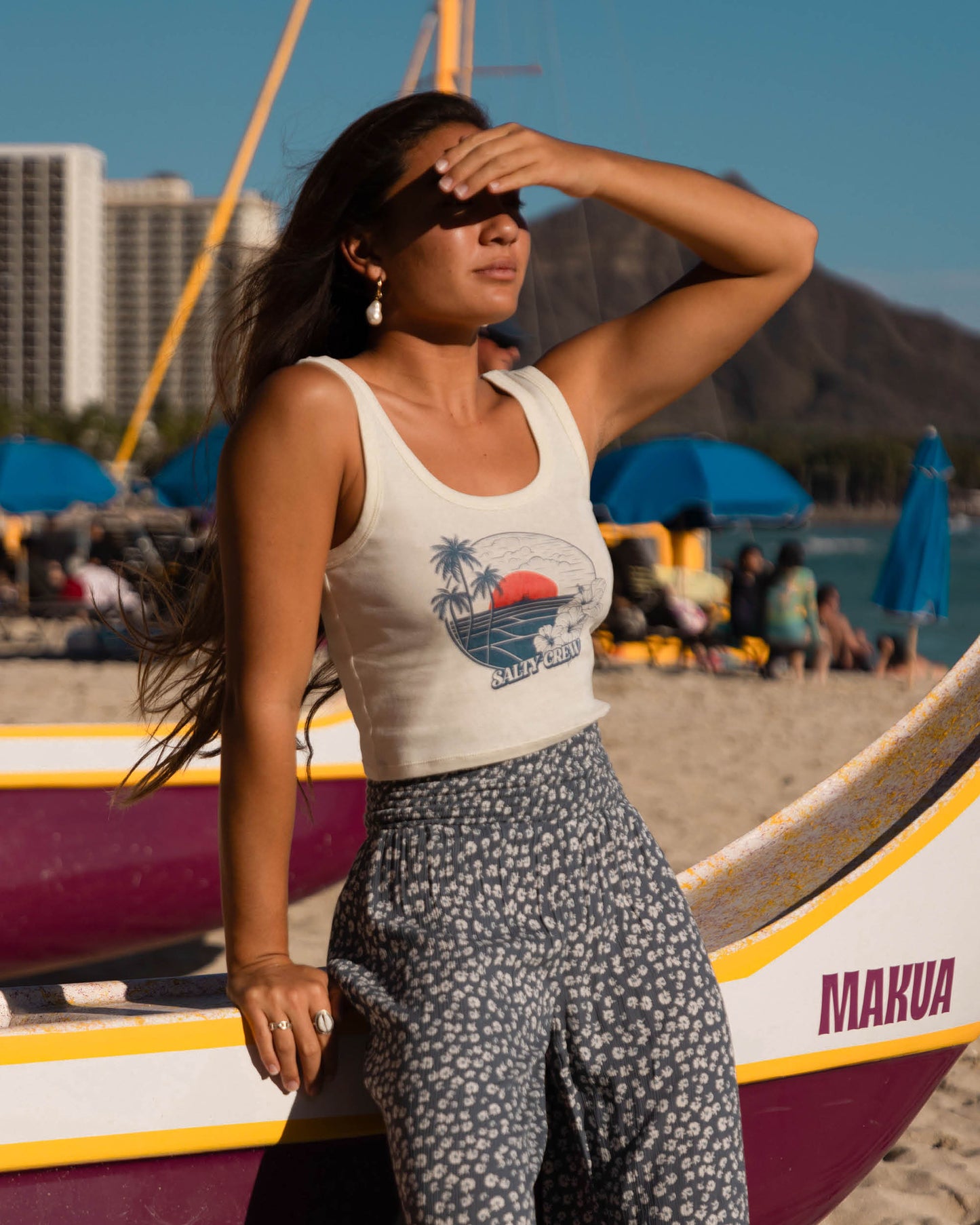 Lifestyle shot of the Beach Scene Tank - Off White. 