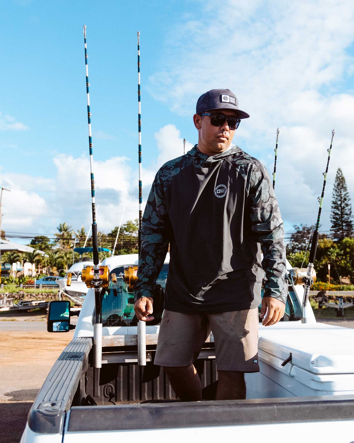 Lifestyle shot of the Apex Perforated Sunshirt Hoodie - Black Camo. 